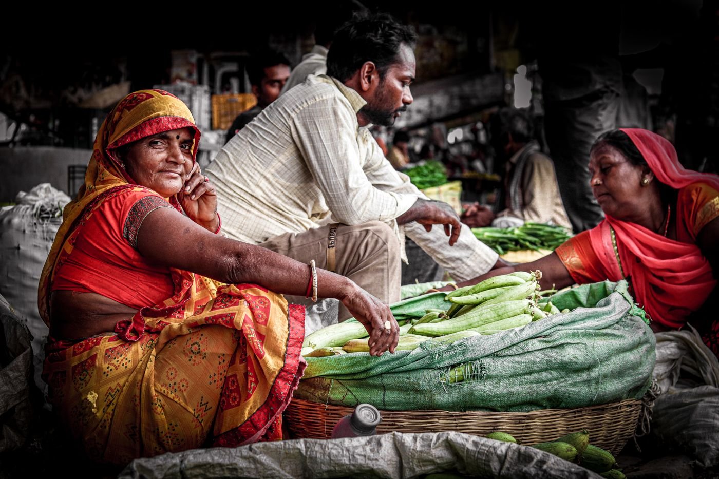 Vendors selling fresh vegetables at an Indian market