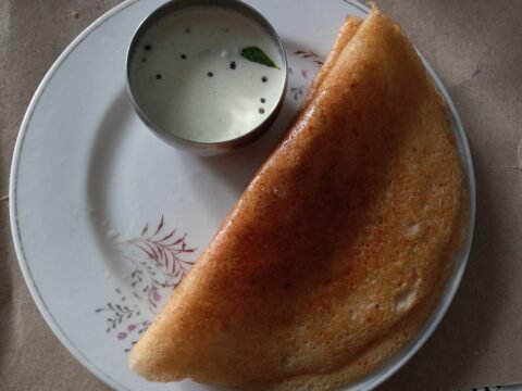 Thick mixed lentil dosa with coconut chutney
