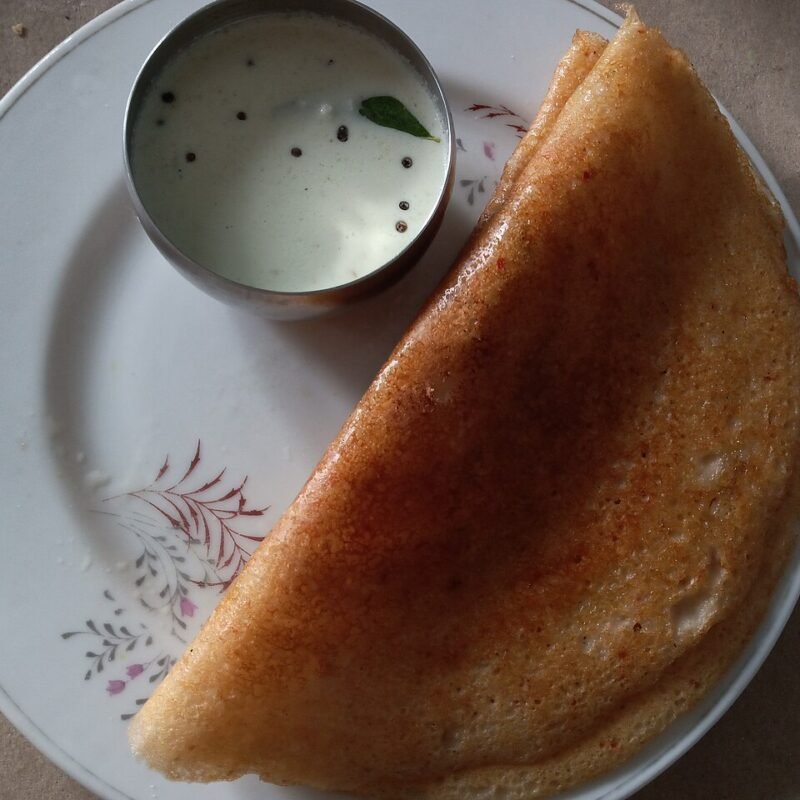 Thick mixed lentil dosa with coconut chutney