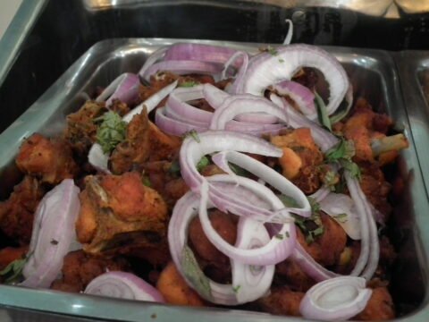 Chicken 65, deep-fried spicy chicken with onions