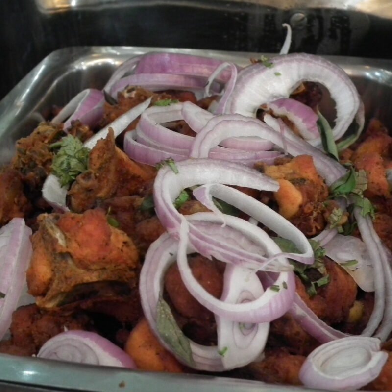 Chicken 65, deep-fried spicy chicken with onions