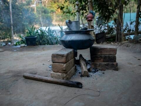 Clay pot cooking over an open flame