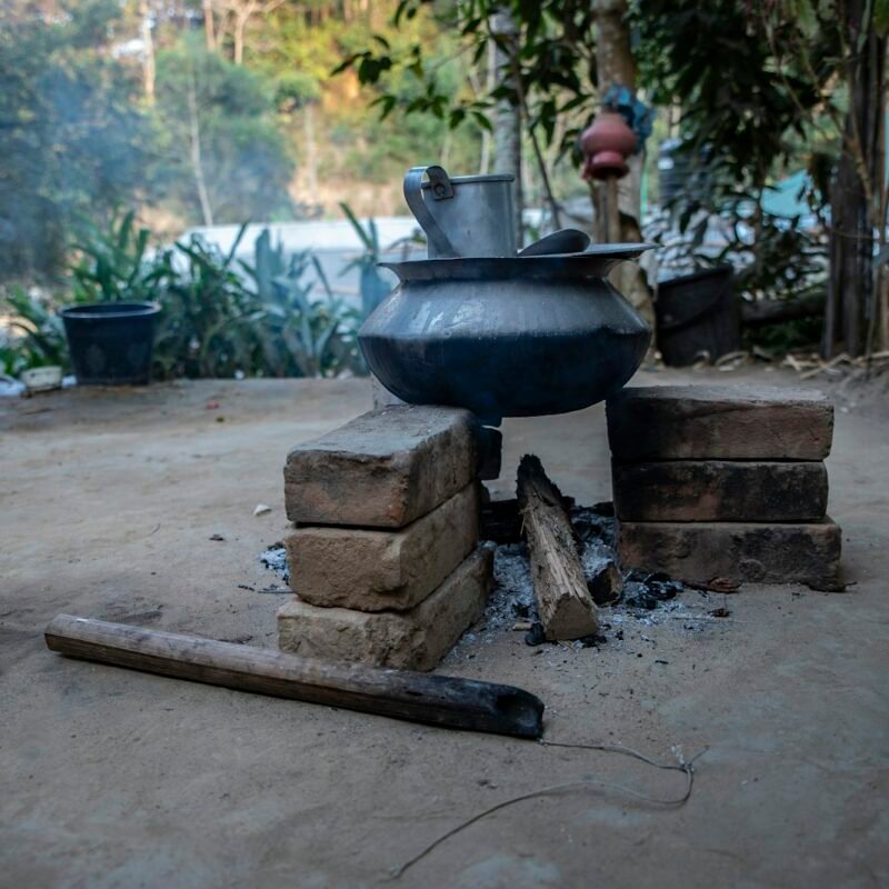 Clay pot cooking over an open flame