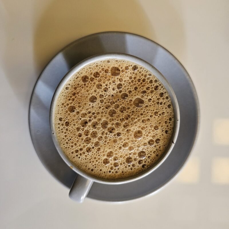 South Indian filter coffee in stainless tumbler and davara