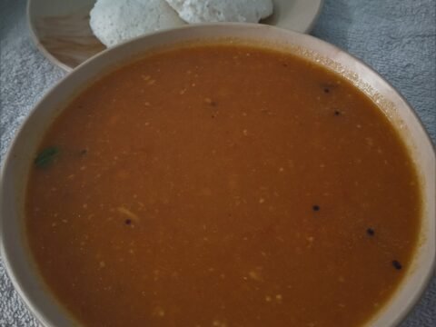 Tangy brinjal side dish served with idli
