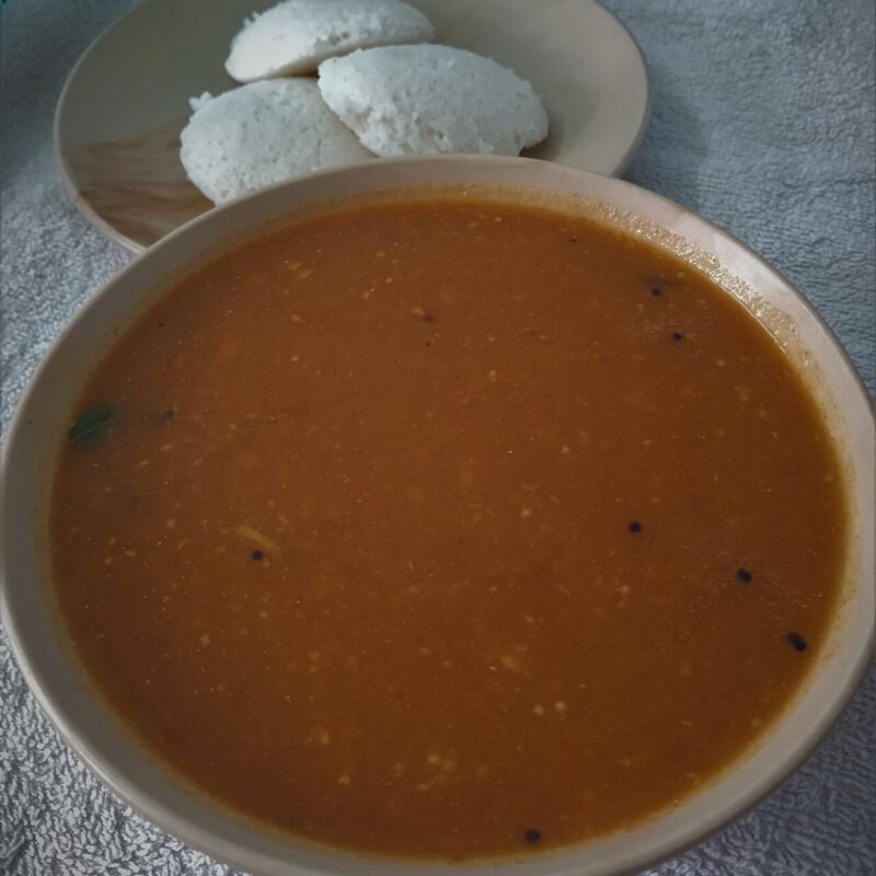 Tangy brinjal side dish served with idli