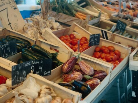 Fresh vegetables in wooden crates at a local market