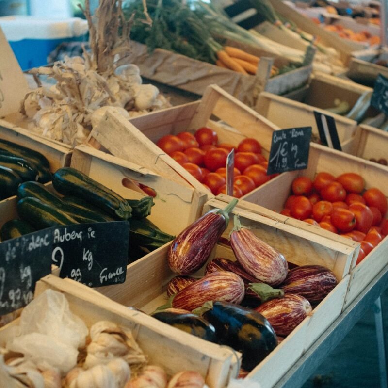 Fresh vegetables in wooden crates at a local market