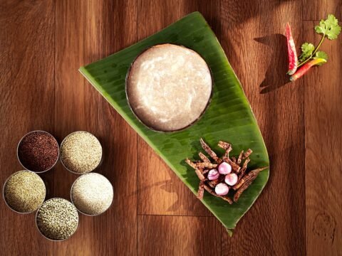 Traditional finger millet porridge served on a banana leaf