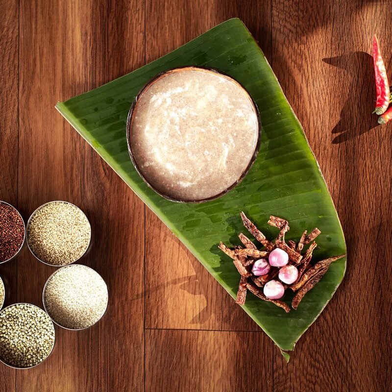 Traditional finger millet porridge served on a banana leaf